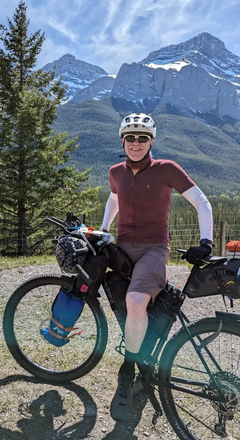 Rob (ThruRider) cycling during a bikepacking adventure