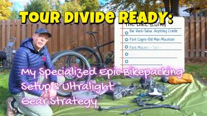 A custom-painted Specialized Epic bike fully loaded with bikepacking bags.
