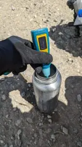 Water System - A close-up of a Ultra Violet filter and Water bottle.